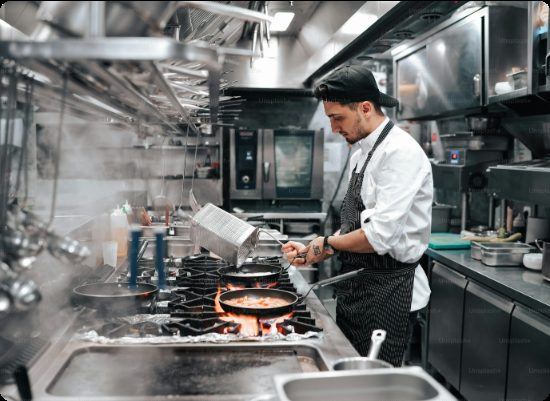Chef working in a stainless steel commercial kitchen